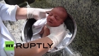 Brazil: Adorable baby BUCKET wash-down soothes new-borns’ nerves