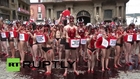 Spain: Half-naked PETA activists pour ‘blood’ on themselves to protest bull running *EXPLICIT*
