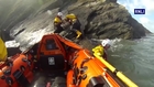 Dog rescued by lifeboat after falling down 291-foot cliffs and getting trapped on a rock for a week