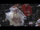 Nats fan struggles to put on rain poncho