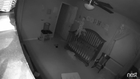 Baby Balances on Side of Crib