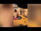 Blush hour traffic as topless woman 'having sex in back of taxi flashes her boobs at stunned drive