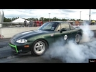 TESLA P85 Gets ZAPPED by Electric MIATA !!  - 1/4 mile Drag Race Video - Road Test TV