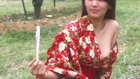 Girl flashes cleavage in skimpy Japanese robe at southern Taiwanese ranch