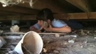 Child Crawls Under Barn to Rescue Puppy