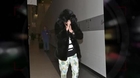 Cara Delevingne Flies Into LAX Dressed Like A Bear